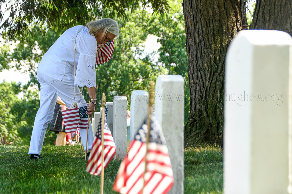 Gold Star Mother Chaplain Elaine Brattain helped in the placing of flags at the headstone of our fallen heroes.